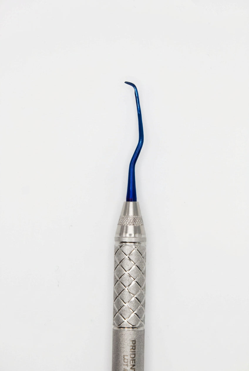 A dental hand instrument with a textured silver handle and a curved blue metal tip, shown vertically against a plain light gray background.