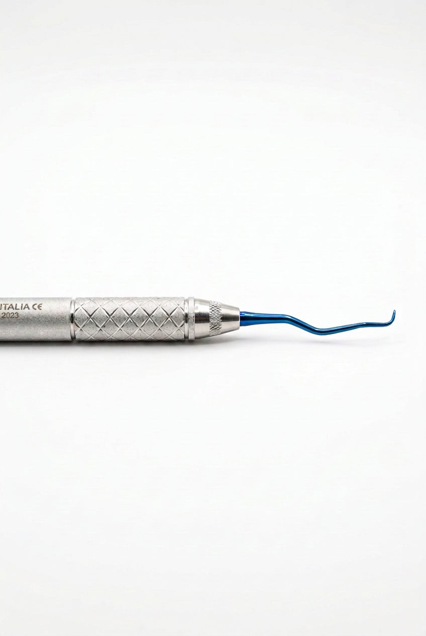 A dental pick tool with a textured silver handle and a curved blue tip, shown vertically against a plain light gray background. The brand name 'ITALACE' is printed on the handle.