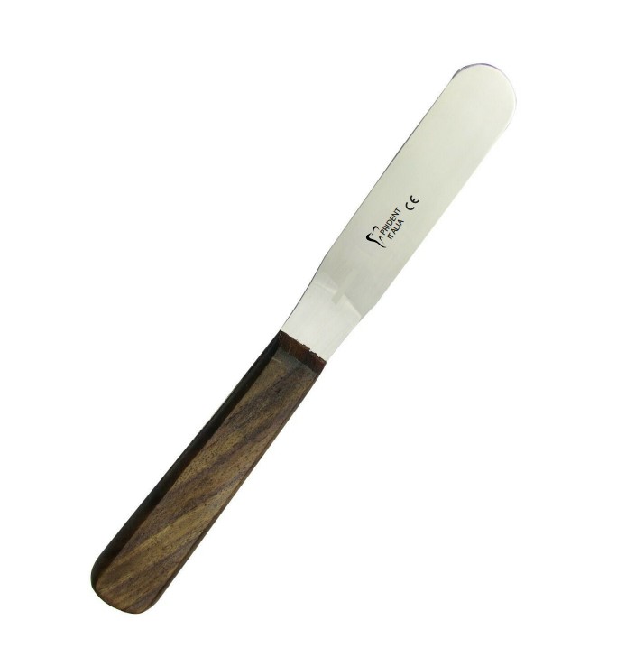 Rubber spatula with a wooden handle available as Framed Prints